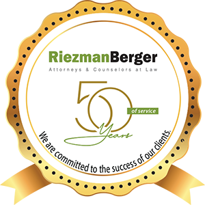 Riezman Berger circular badge